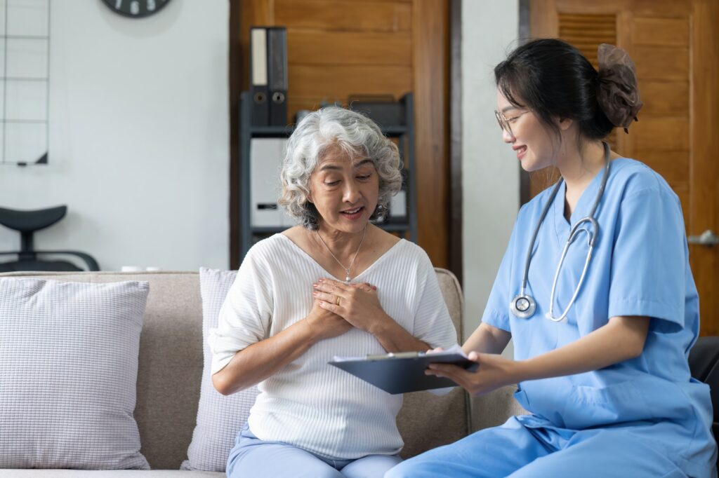 young asia female nurse assisted living in home carer or doctor visit old senior citizen at home.jpg